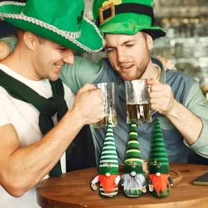 A detailed view of three decorative St. Patrick's Day gnomes on a festive pub table