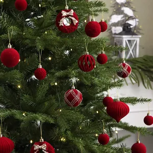 48-piece set of luxury red flocked Christmas ornaments hanging on a festive tree
