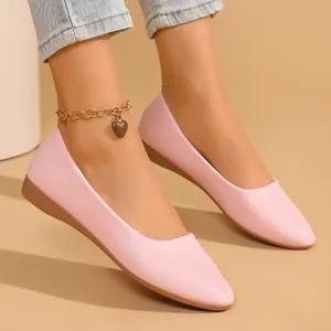Elegant pink pointed-toe flat shoes with a textured leather finish and casual style.
