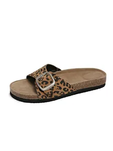 Side view of trendy leopard print slide sandal featuring a stylish silver buckle closure