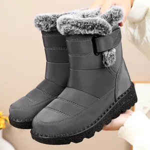 Close-up of waterproof mid-calf snow boots with plush faux fur and velcro strap