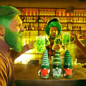 Three decorative St. Patrick's Day gnomes with green striped hats and Lucky embroidery