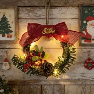 Christmas wreath with red burlap bow, pine cone, red berries and warm LED lights