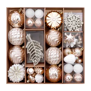 62-piece rose gold and white Christmas ornament set with various hand-painted baubles