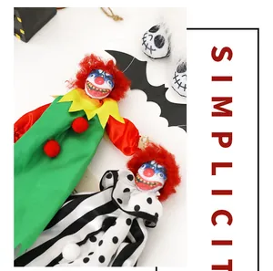 Close-up of scary Halloween clown doll pendants for haunted house party decoration
