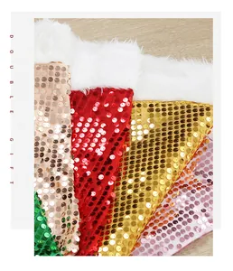 Detailed macro view of colorful sequin Christmas tree skirts with soft white plush trim