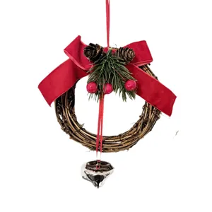 Christmas rattan wreath with red velvet bow, pine cones, and silver believe bell