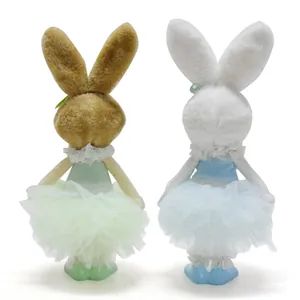 Back view of two cute plush Easter bunnies wearing pastel green and blue tutu skirts
