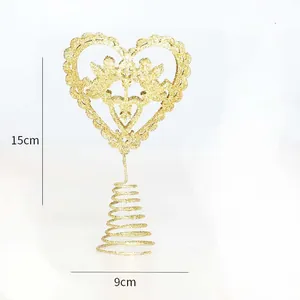 Detail view of gold glitter heart-shaped Christmas tree topper with angel design