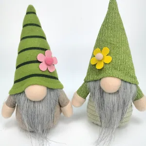 Close-up of handmade St. Patrick's Day gnomes with green hats and colorful flowers