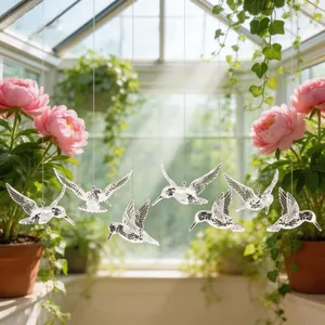 Set of transparent acrylic hummingbird hanging decorations for home or wedding decor.