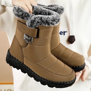 Detailed view of women's brown waterproof snow boots featuring plush faux fur lining