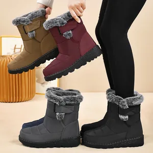 Women's waterproof snow boots with faux fur lining and adjustable strap in multiple colors