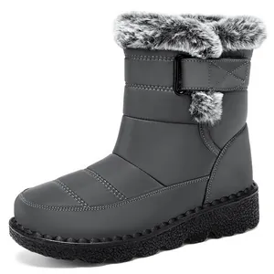 Side view of grey waterproof snow boots for women with faux fur trim and thick sole