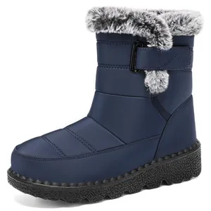 Side profile of navy blue waterproof snow boot with fluffy faux fur trim and velcro strap.