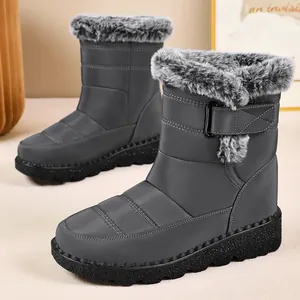 Detailed side view of grey waterproof snow boots with plush faux fur lining