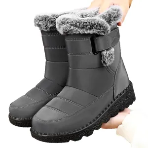 Waterproof grey women's mid-calf snow boots featuring faux fur trim and velcro strap