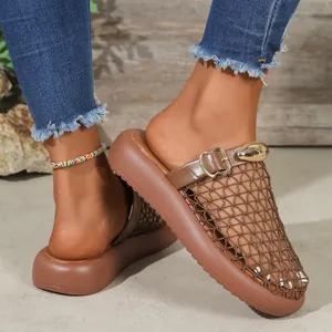 Close-up detail of brown mesh breathable mules featuring gold buckle and platform sole