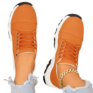 Women's orange thick sole canvas sneakers with color-block platform and lace-up closure