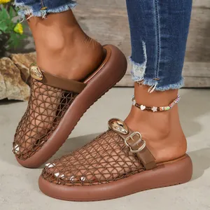 Detailed shot of brown breathable mesh platform slides with golden buckle detail.