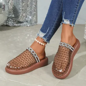 Detail of brown mesh slides with breathable upper and sparkly rhinestone chain