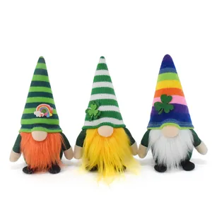 Set of three St. Patrick's Day gnomes with shamrocks and colorful striped hats in macro detail