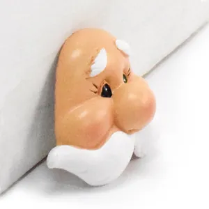 Detailed macro view of a hand-painted resin gnome face accessory for DIY doll making