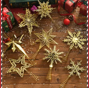 Assorted gold electroplated hollow Christmas tree toppers in star and snowflake shapes