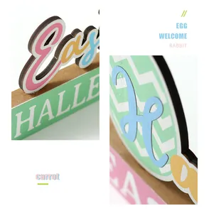 Detailed view of colorful wooden Easter decorations featuring rabbit and egg motifs