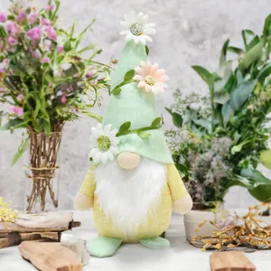 Detailed view of a spring floral gnome doll with daisy-decorated green hat and white beard