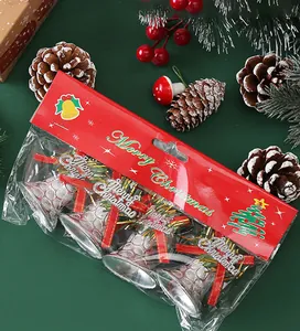 Detailed view of silver Christmas bell ornaments stored in festive red holiday packaging