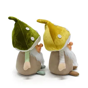 Side profile view of charming mushroom head gnome plush decorations in green and yellow.
