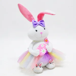 Easter decorative plush bunny ornament wearing a rainbow tutu and holding a floral egg