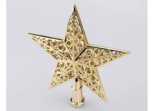 Detailed macro shot of a 15cm golden hollowed-out pentagram Christmas tree topper star