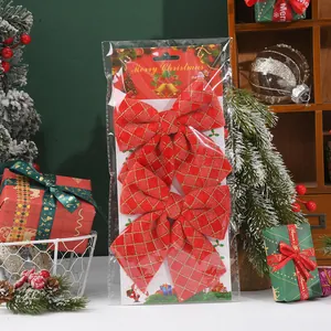 2-pack large red Christmas bows with gold grid pattern in festive retail packaging