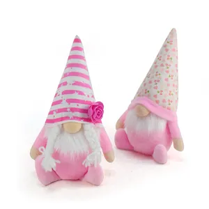 Zwei rosa Valentinstag-Gnome mit gemusterten Hüten und weißen Bärten auf weißem Grund.