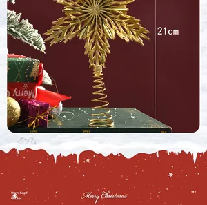 Close-up of 21cm gold electroplated hollow Christmas tree topper star on a festive background
