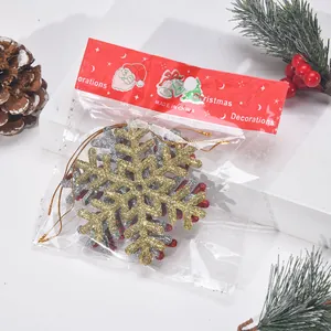 Detail view of Christmas sequined snowflake ornaments in original packaging with header card