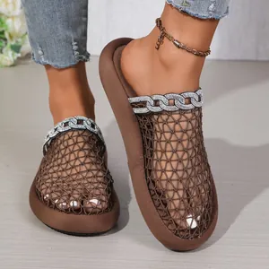 Close-up of women's breathable mesh slides featuring sparkling rhinestone chain decor