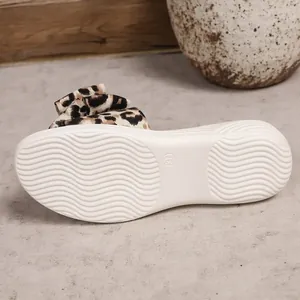 Leopard print bow flat slide sandals for women featuring anti-slip wavy textured white sole