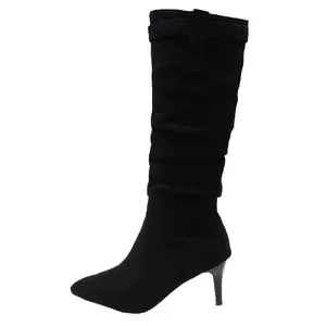 Side view of black suede slouchy knee-high boots with pointed toe and slim high heels