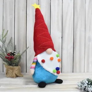 Close-up of a festive Christmas gnome doll with colorful pompoms and red hat