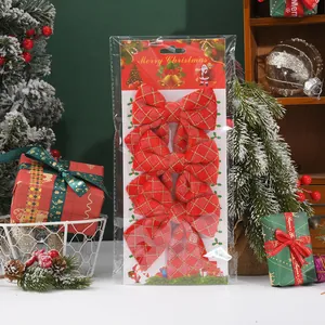 Festive set of 4 red Christmas bows with gold diamond patterns in original packaging.