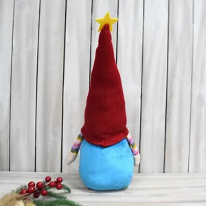 Handmade plush Christmas gnome featuring a red knitted hat with star and blue body