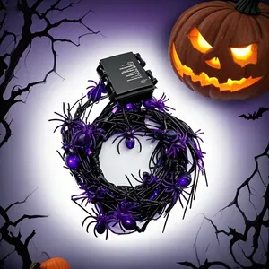 Detail of Halloween purple spider string lights with battery box and spooky pumpkin
