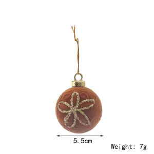Close-up detail of a brown flocked Christmas ball ornament with a 5.5cm diameter