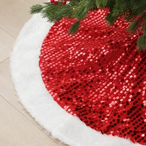 Festive red sequin Christmas tree skirt with white plush trim shown on light wood floor