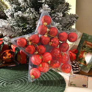 Red Christmas baubles set in a star-shaped gift box with glitter and matte textures