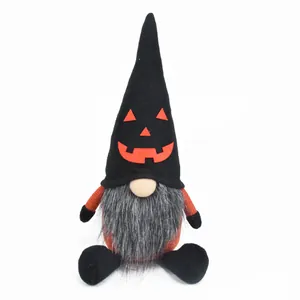 Detail showing a Halloween gnome plush featuring an orange pumpkin face and long gray beard