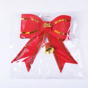 Red Christmas bow decoration with gold bell in transparent packaging